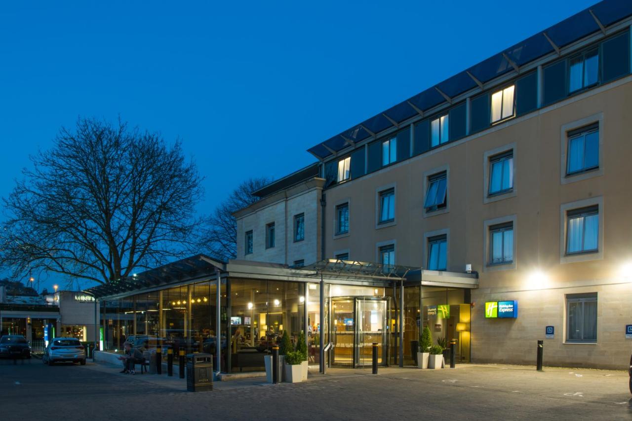 a building in front of a building at night at Holiday Inn Express Bath by IHG in Bath