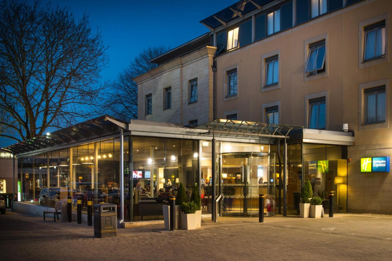 a store front of a building at night at Holiday Inn Express Bath by IHG in Bath